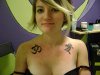 $om-symbol-and-chinese-symbol-tattoo-on-girl-chest.jpg