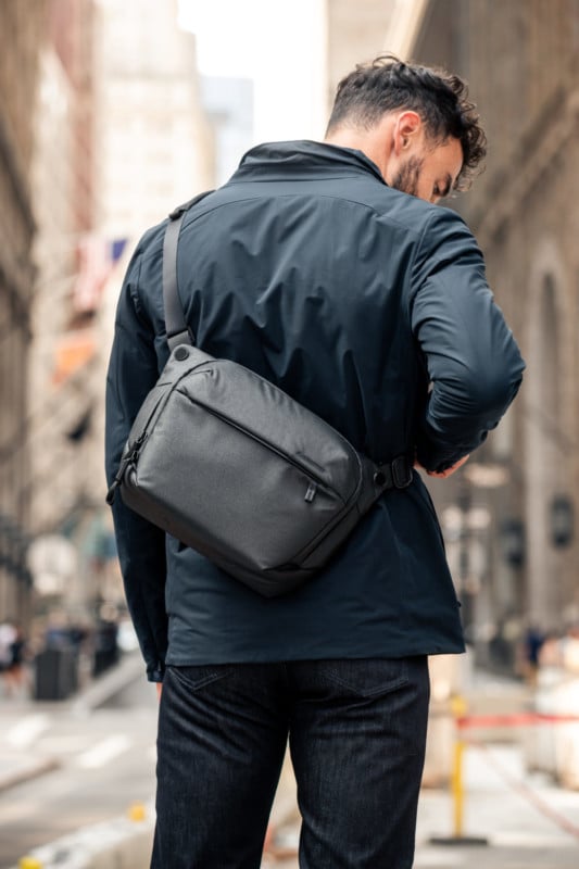 A man wearing a camera pack on his back