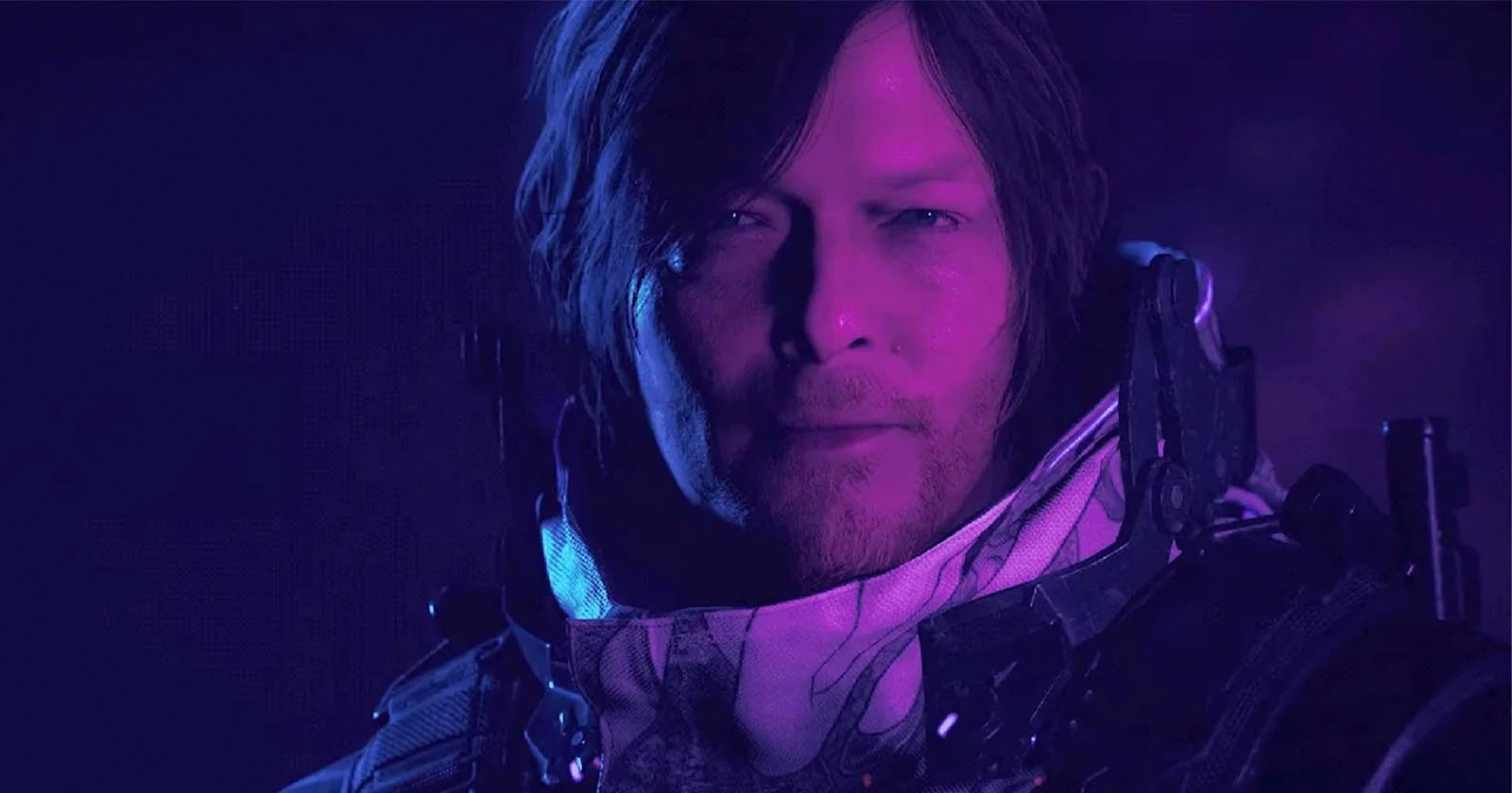 A close-up of a male character with shoulder-length hair and a serious expression, illuminated by purple and blue lighting, wearing a futuristic suit with visible armor and mechanical details.