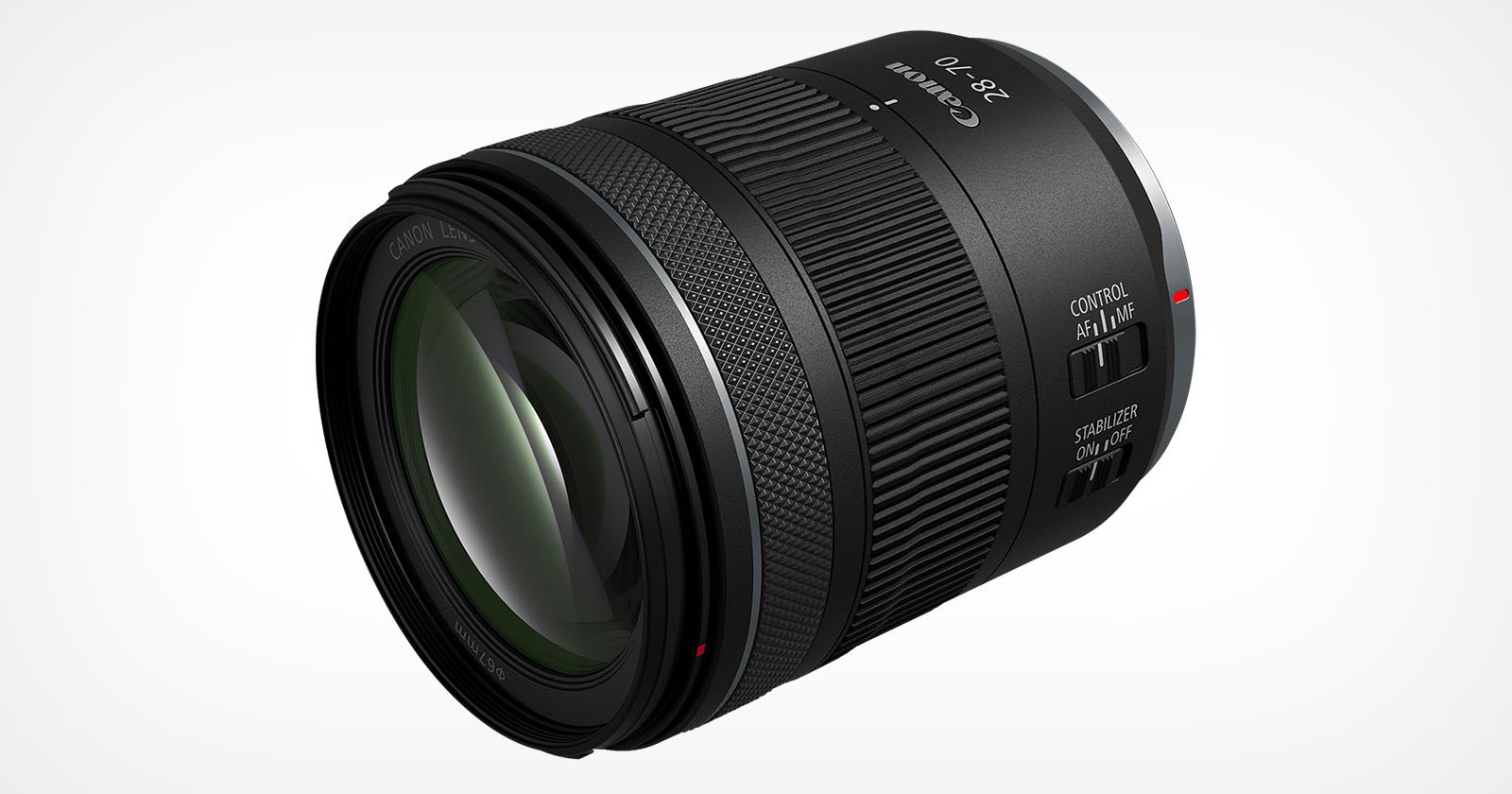 A black camera lens with a wide, clear front element, labeled 28-70 and Canon Lens. The lens has textured grip rings, control switches, and various markings and text in white. The background is plain white, highlighting the lens's details.