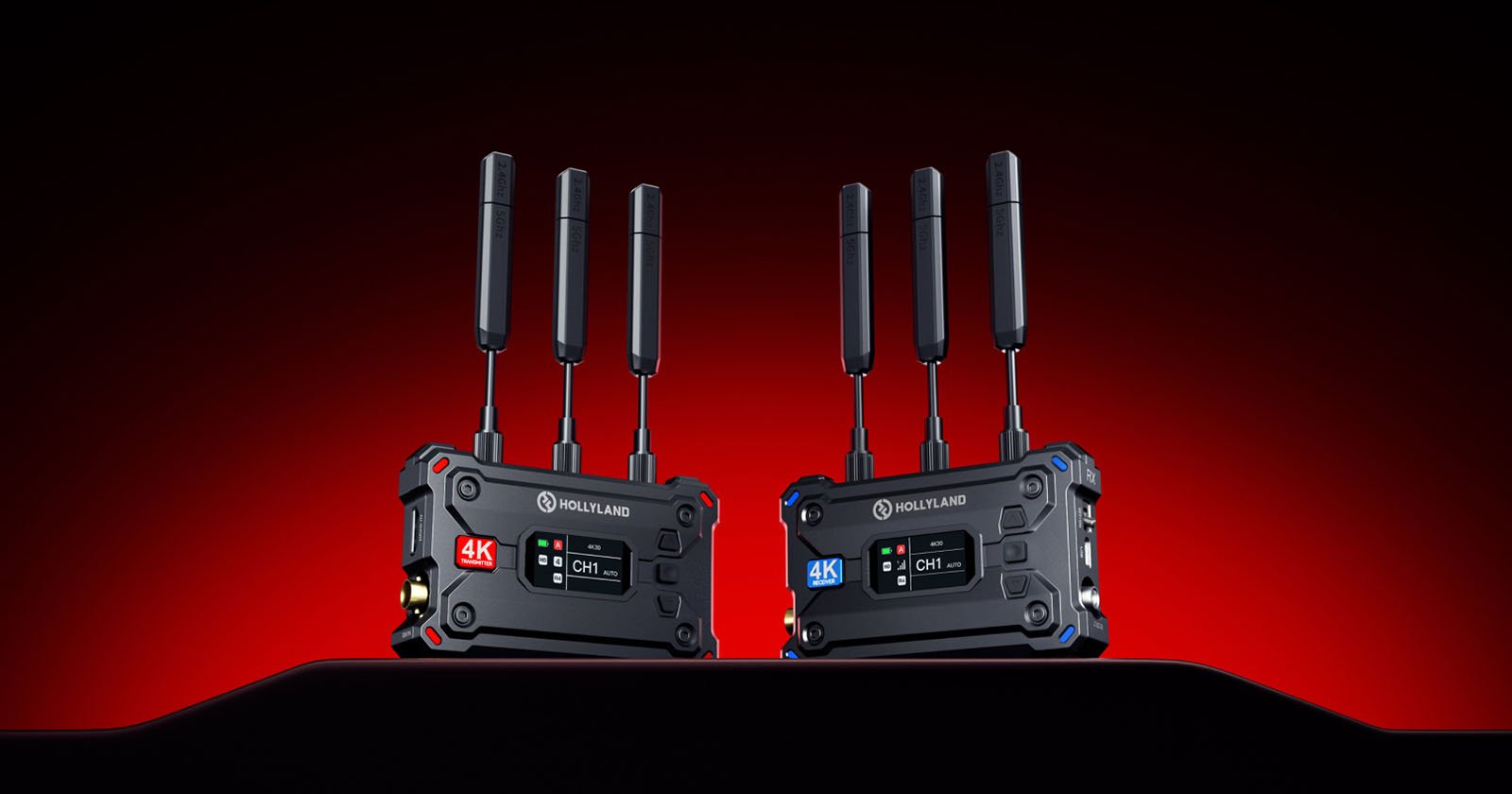 Two Hollyland video transmission devices with antennas stand on a black surface against a red and black gradient background. They feature digital screens displaying 4K and channel information.