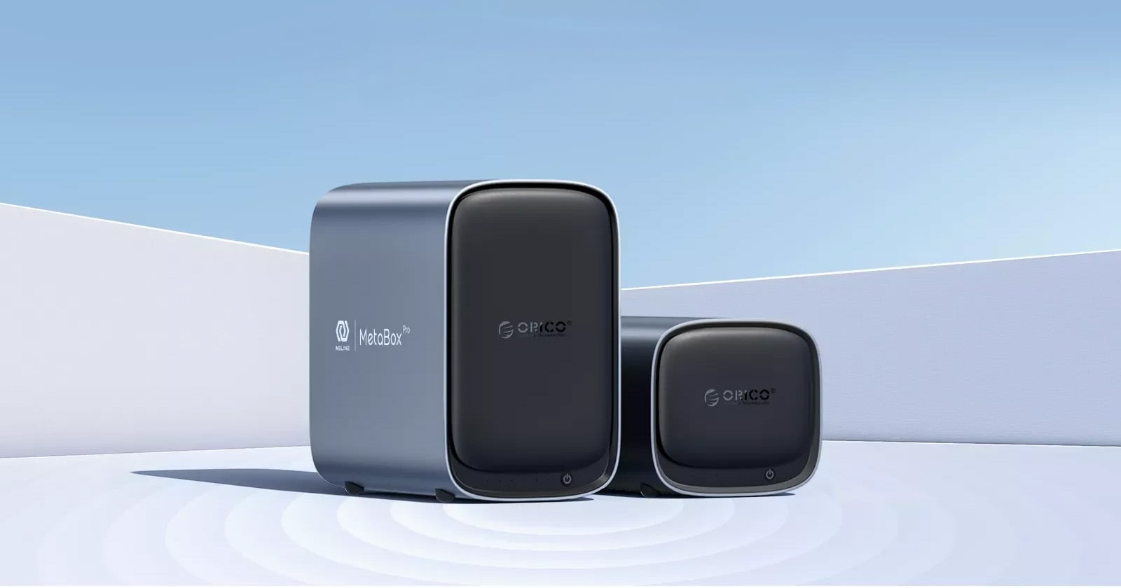 Two sleek, modern network devices labeled “Mercusys MetaBox” and “Gopico” are displayed outdoors against a minimalist white and blue background with soft shadows.