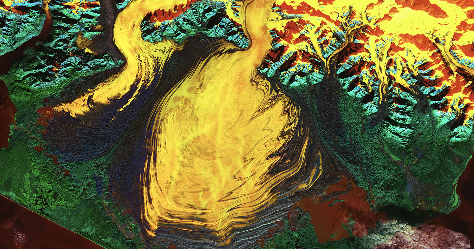 Satellite image of Malaspina Glacier in Alaska shows the formation in bright yellow.