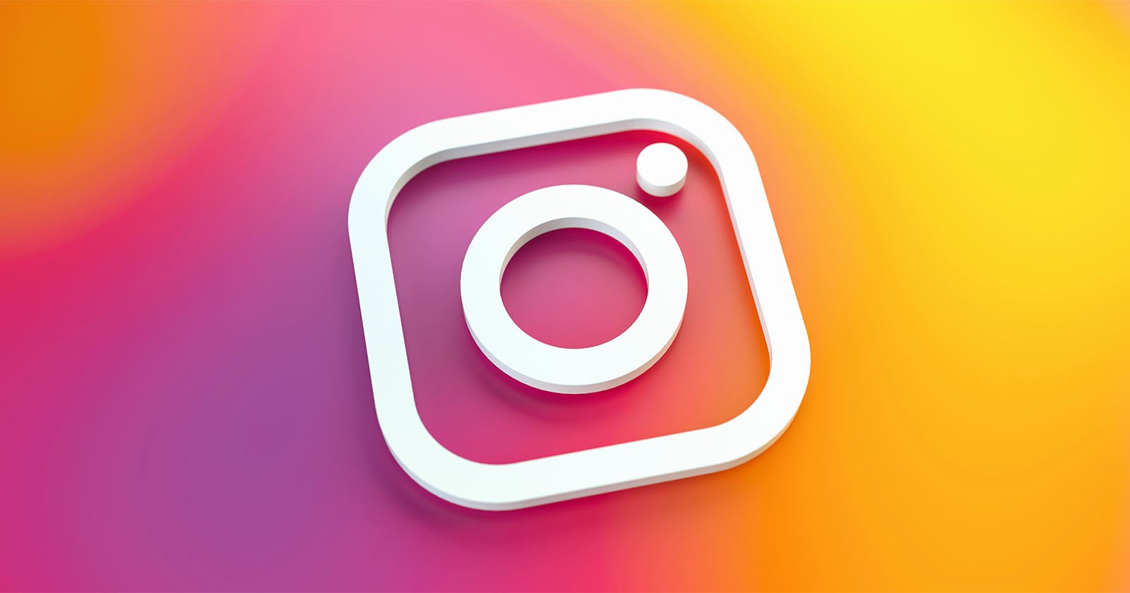 A white Instagram logo icon is displayed on a vibrant, gradient background blending pink, orange, and yellow colors.