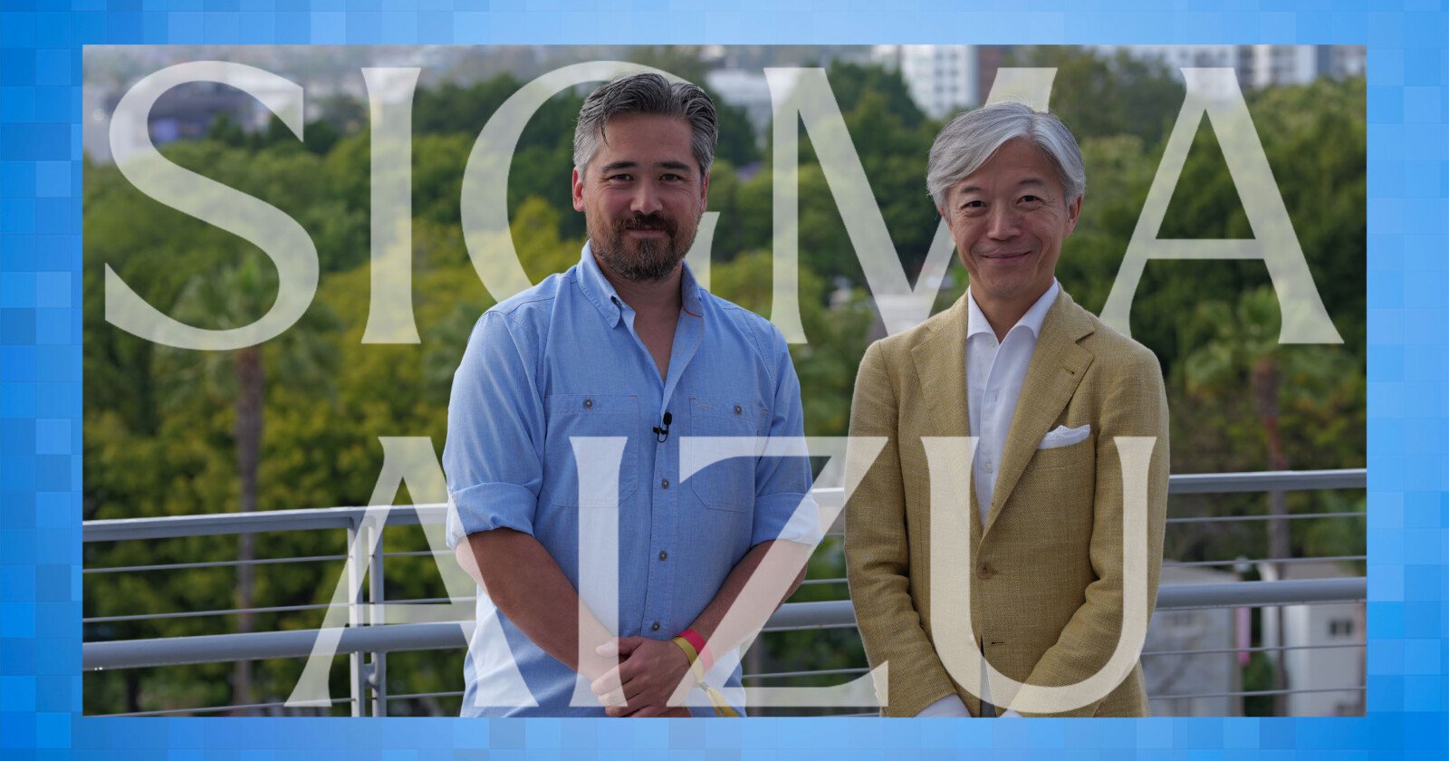 Two men stand side by side outdoors in front of greenery, one wearing a light blue shirt and the other a light brown suit. Large translucent text reads SIGMA AIZU across the image.