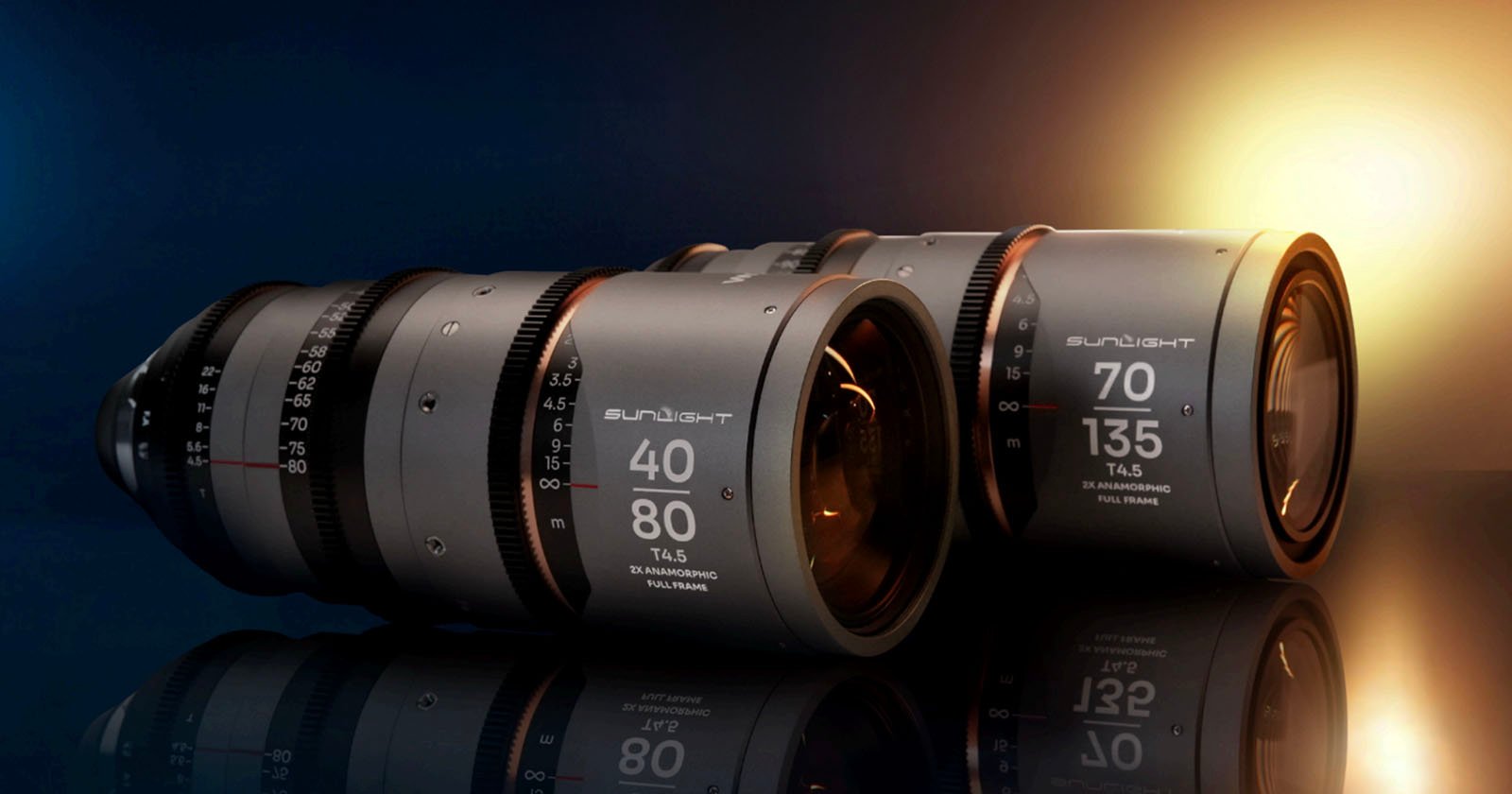 Two professional camera lenses with markings 40-80mm and 70-135mm rest side by side on a reflective surface, illuminated by dramatic blue and yellow lighting in the background.