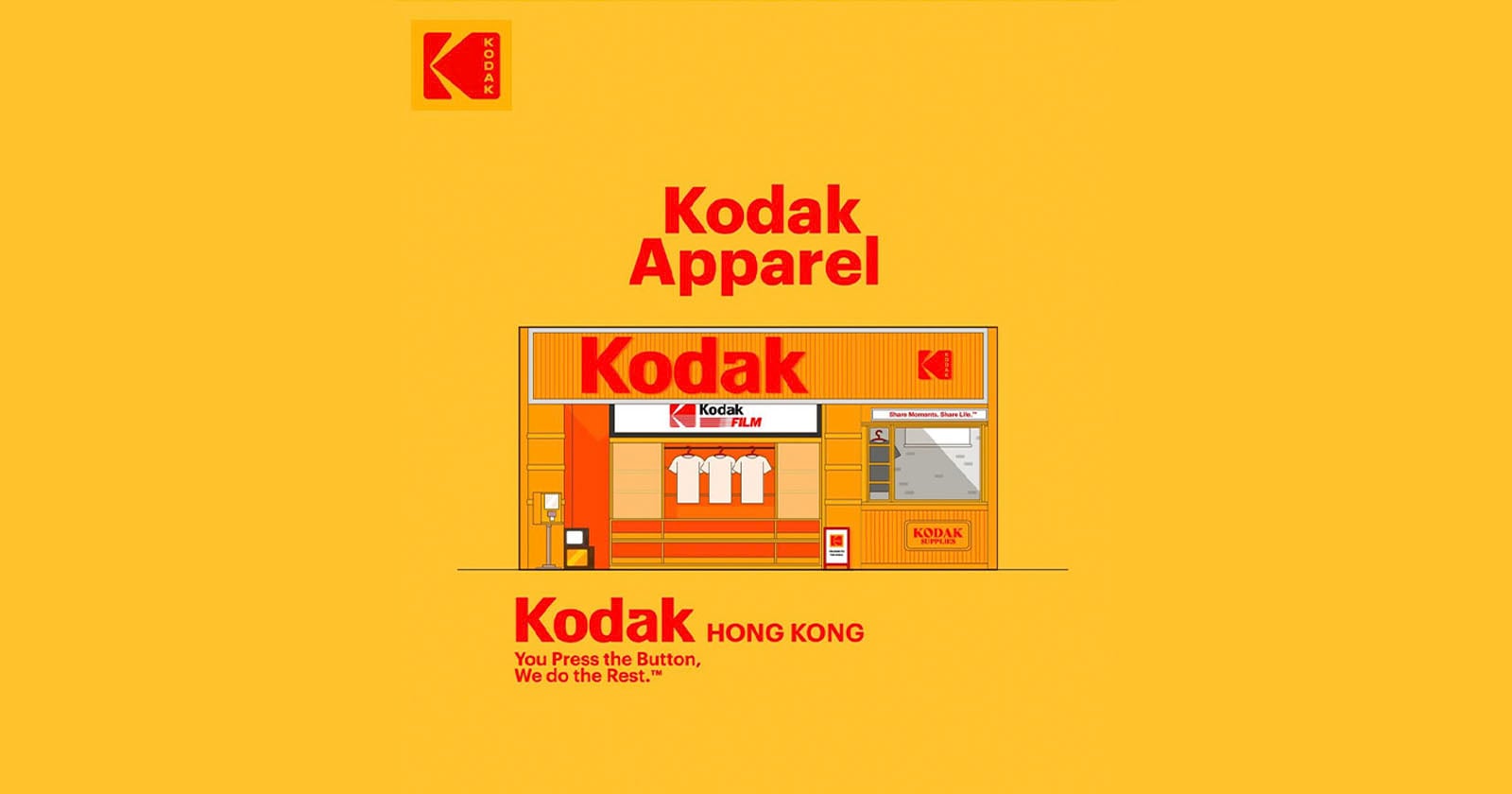 Illustration of a Kodak storefront labeled Kodak Apparel with shirts and film in the window, set on a yellow background. The Kodak logo appears at the top left and above the store. Text reads: You Press the Button, We do the Rest.