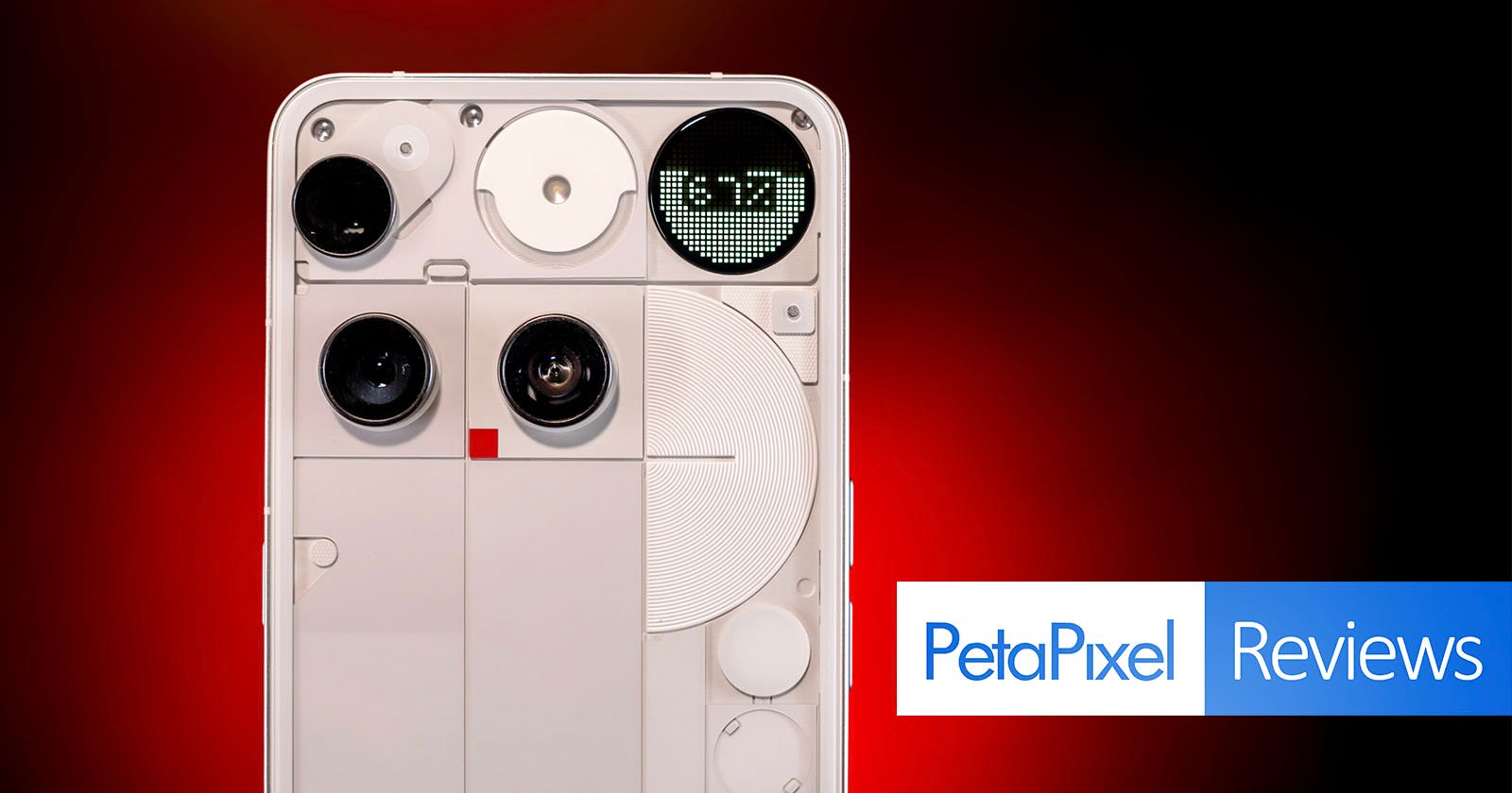 A white smartphone with exposed components and a unique rear design is displayed against a red-black gradient background. The screen shows 5:17. The Petapixel Reviews logo appears in the bottom right corner.