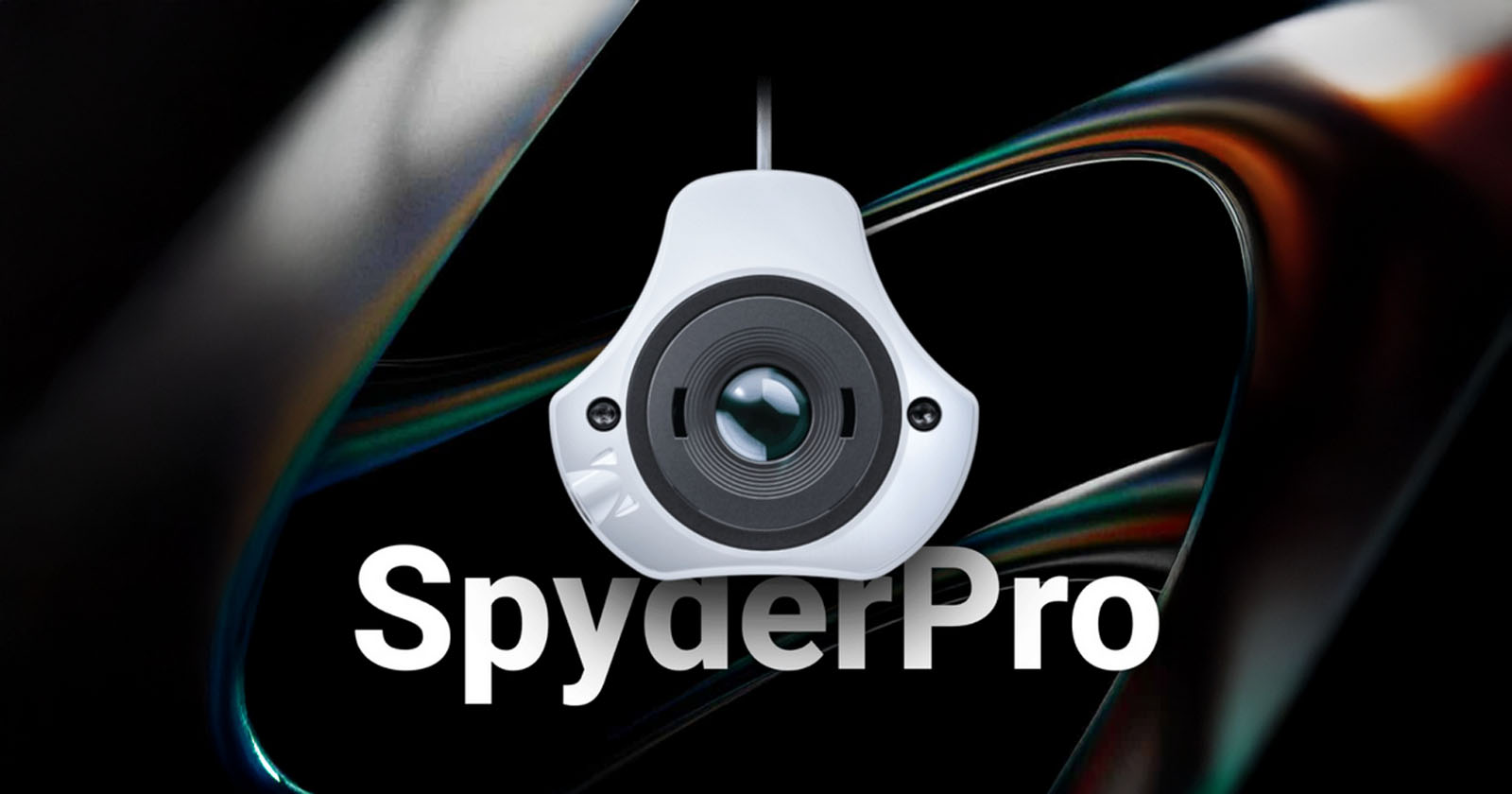 A close-up of a SpyderPro calibration device hanging against a dark, abstract background, with the word SpyderPro in bold white text below.