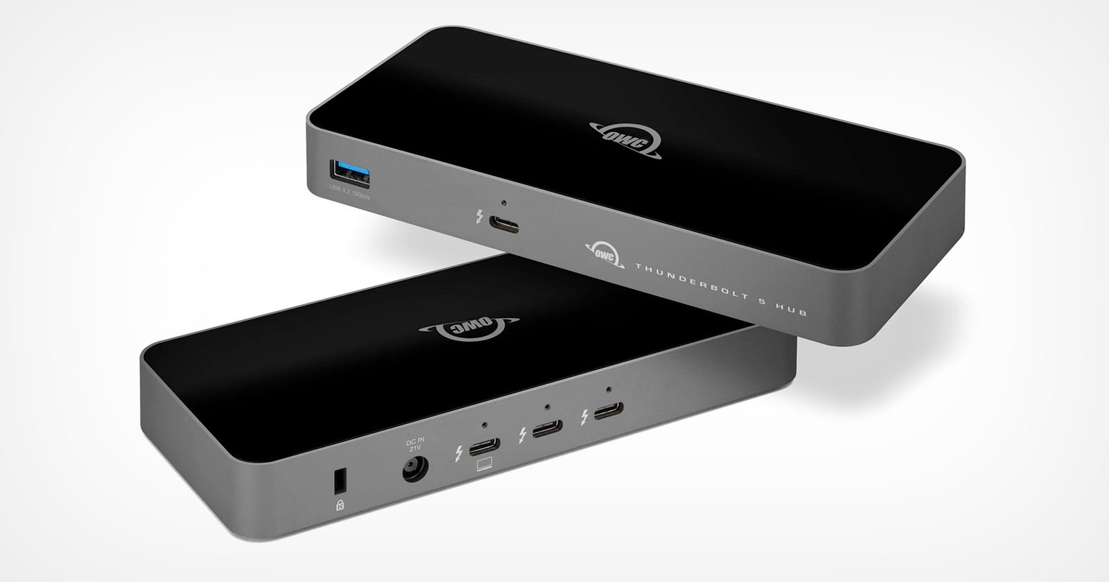 Two black rectangular electronic hubs with multiple ports are shown, including USB-C, HDMI, and audio jacks. The hubs have the OWC logo and are labeled Thunderbolt 3 Hub. The background is light gray.