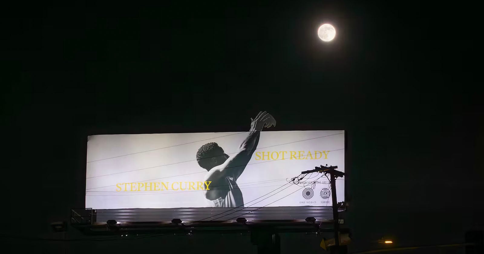 A billboard at night shows a black-and-white image of a basketball player shooting, with the words STEPHEN CURRY and SHOT READY. A full moon glows above the billboard in the dark sky.