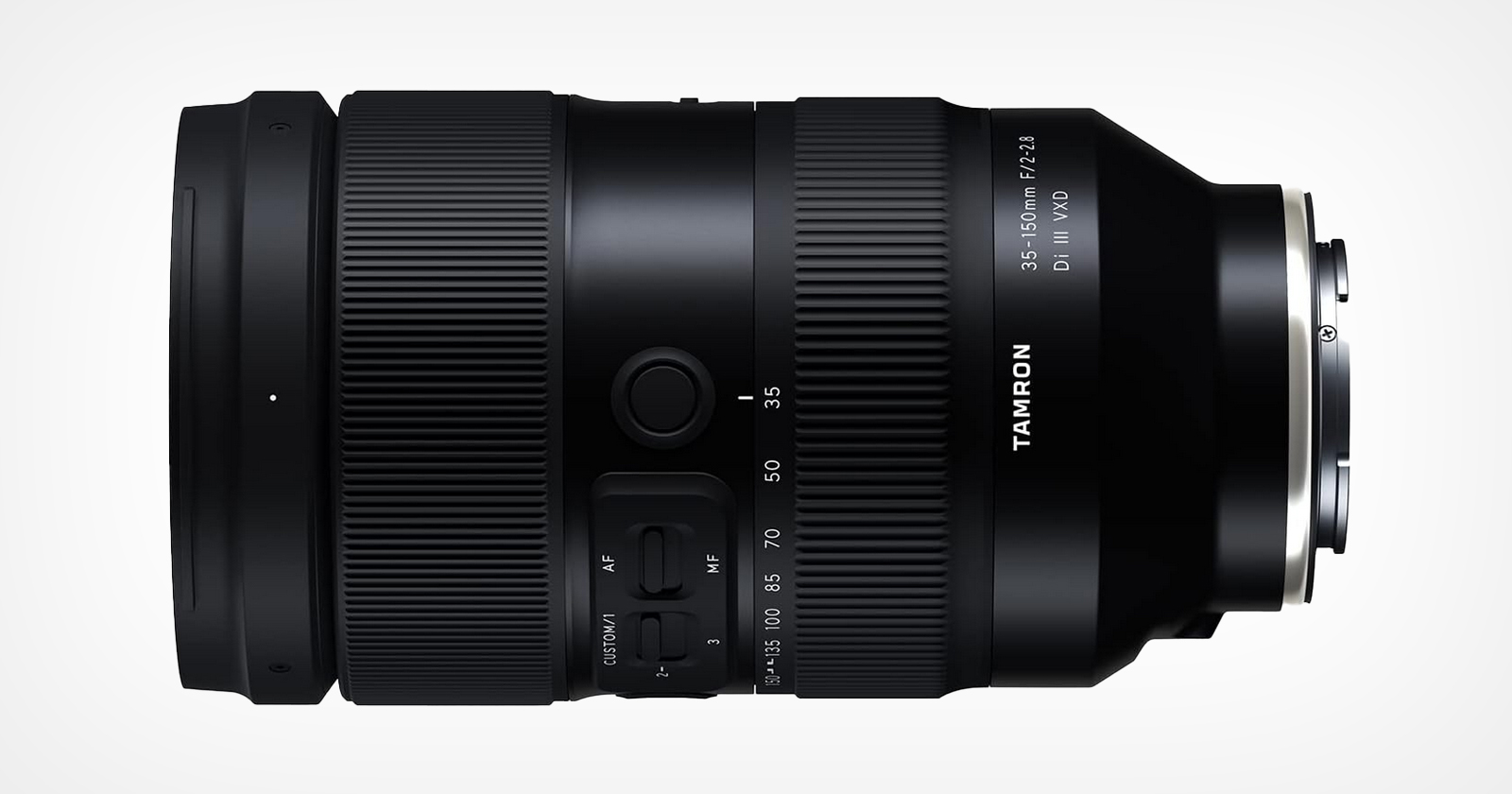 A black camera lens with a sleek design, displaying the Tamron logo and specifications: 35-150mm F/2-2.8 Di III VXD. The lens features manual controls and zoom markings on its surface, set against a light gray background.