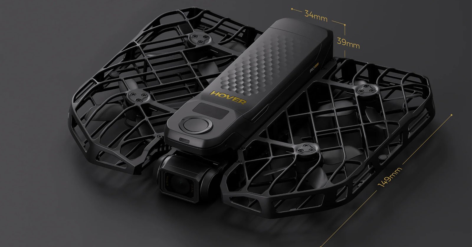 A compact black drone with foldable propeller guards and the word HOVER printed on top, displayed on a dark background. The drone features measurements indicating its width (39mm), height (34mm), and length (140mm).