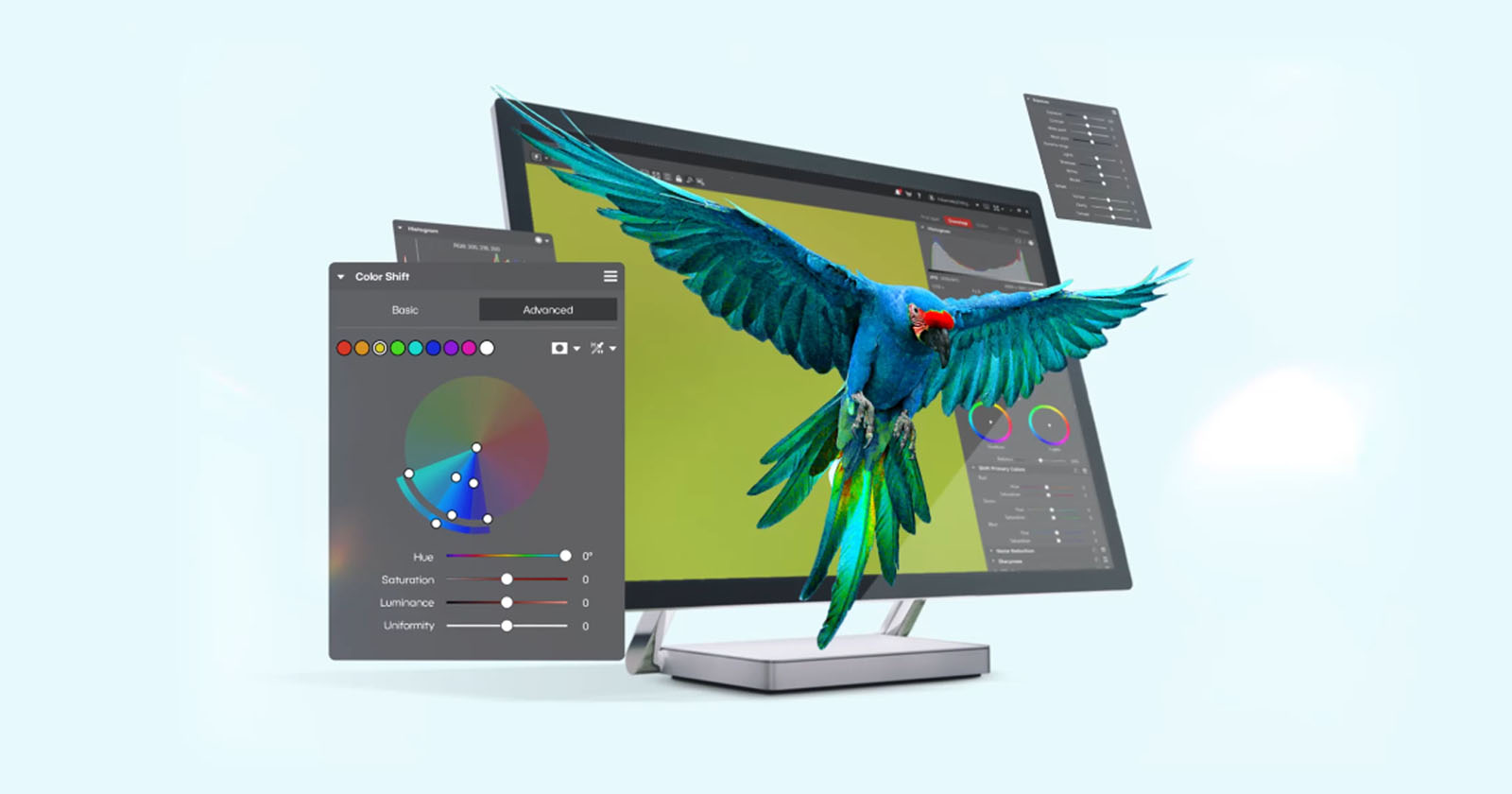 A colorful parrot appears to fly out of a computer monitor displaying graphic design software, with color adjustment panels and editing tools floating in the air.