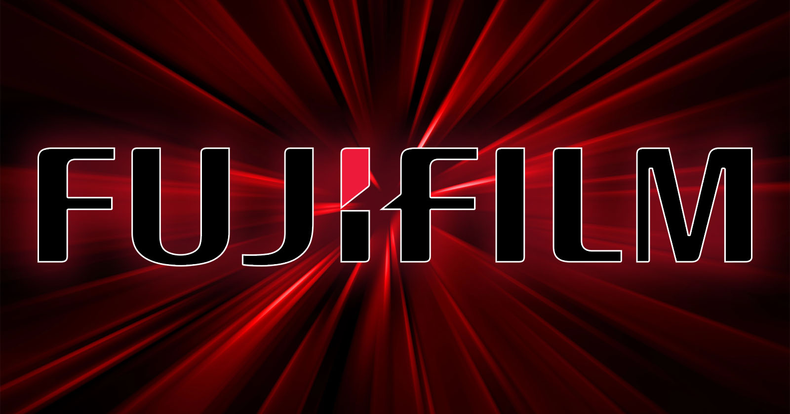 A glowing red background with the bold, uppercase text FUJIFILM displayed prominently in black with white outlines. A stylized design in white and red is used for the J in FUJIFILM. Radiating lines give a dynamic effect to the background.