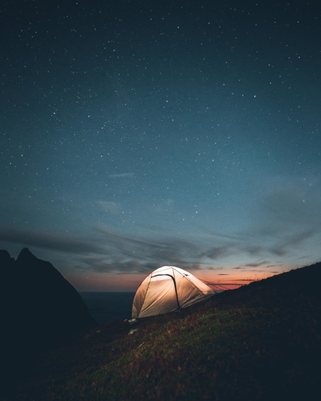 setting up a tent in lofoton to see the stars