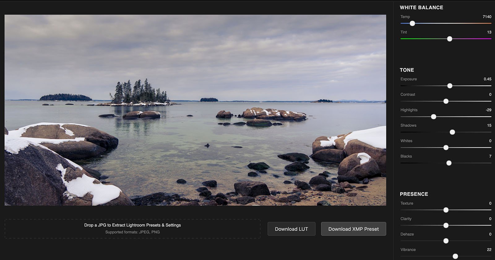 A landscape photo of a rocky shoreline with scattered snow-covered boulders. An island with trees is visible in the background. The image is displayed in a photo editing software interface, showing various adjustment sliders on the right.