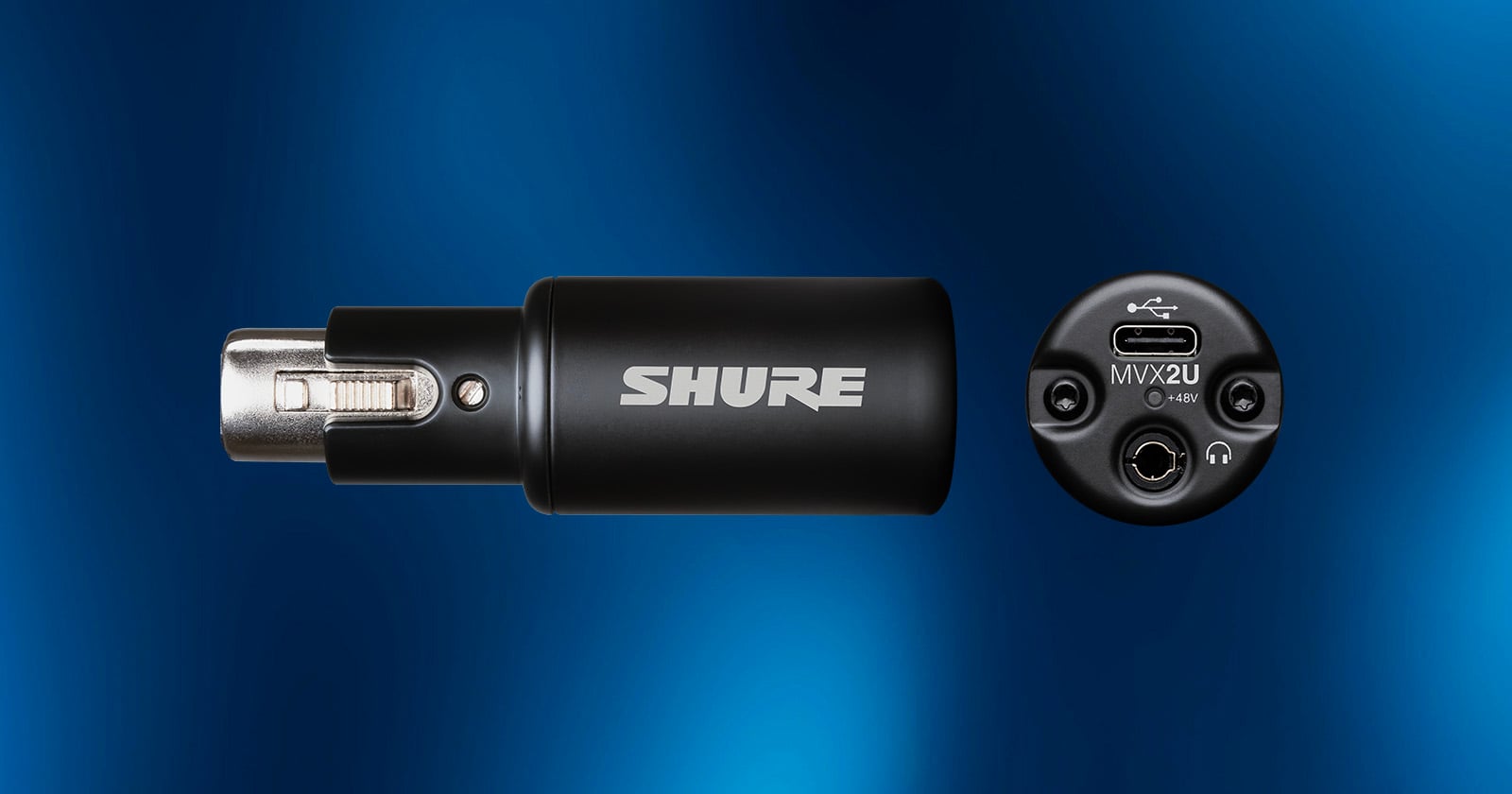 Black Shure audio adapter shown from the side with logo visible and from the end, displaying XLR, USB-C, and headphone ports against a blue gradient background.