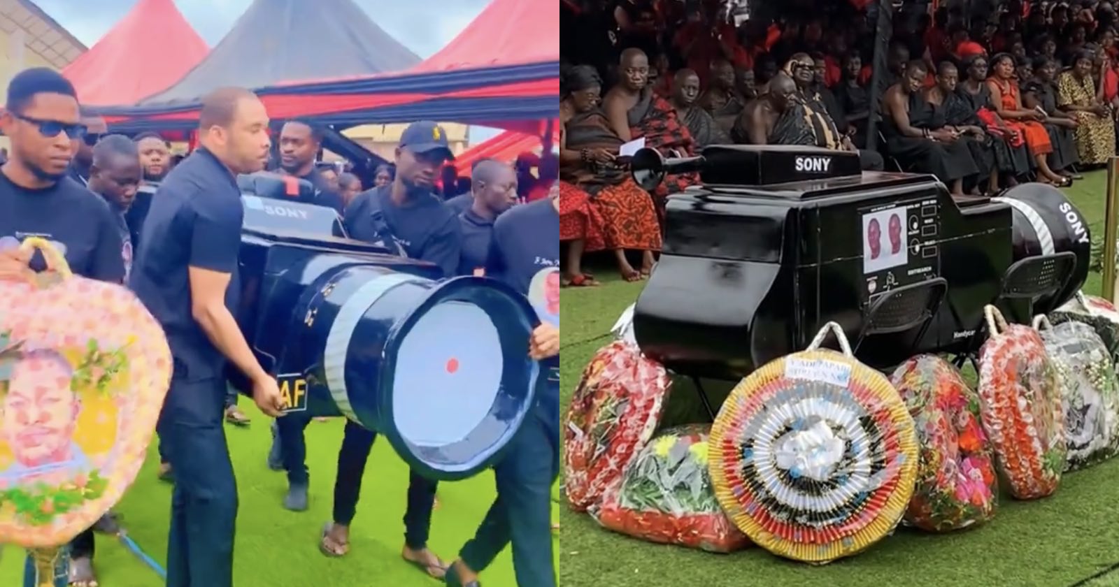 Pallbearers carry and display a coffin shaped like a large Sony camera lens, surrounded by funeral wreaths and mourners dressed in black and red attire at an outdoor ceremony.