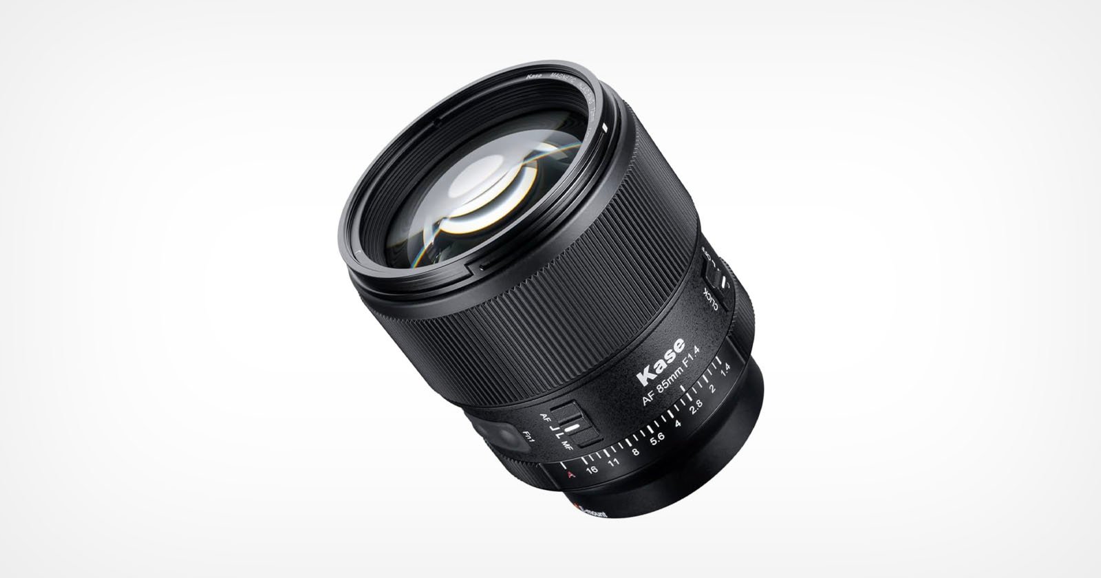 A black Kase camera lens is shown angled on a white background, featuring focus and aperture rings, with visible lens glass and markings for aperture settings.