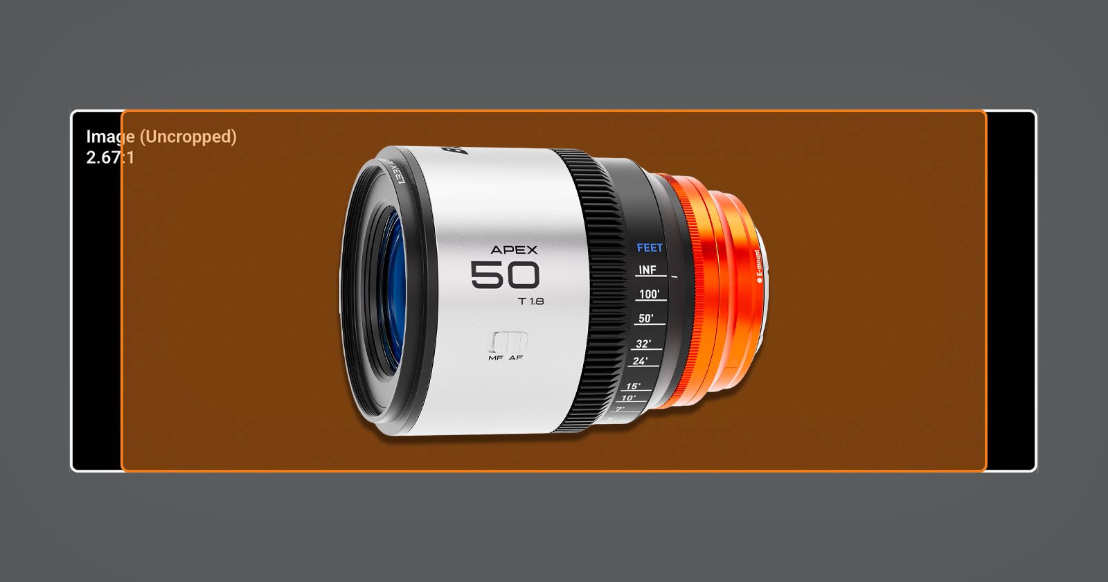 A white and orange camera lens marked APEX 50 T1.8 is displayed in the center of a brown rectangular frame on a gray background with measurement markings and interface graphics.