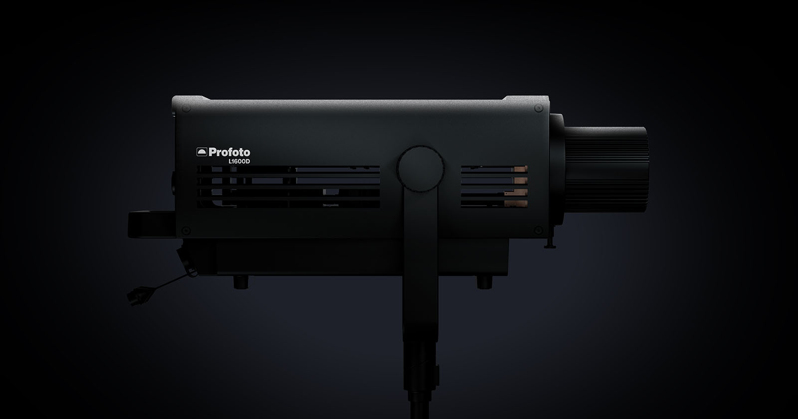 A side view of the Profoto B10x flash unit against a dark background. The flash unit is mounted on a stand and features a cylindrical body with vents and a large knob at the back for adjustments. The brand name Profoto and model B10x are visible.