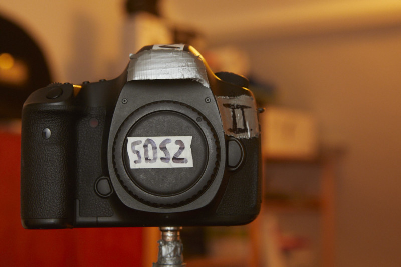 A DSLR camera on a tripod