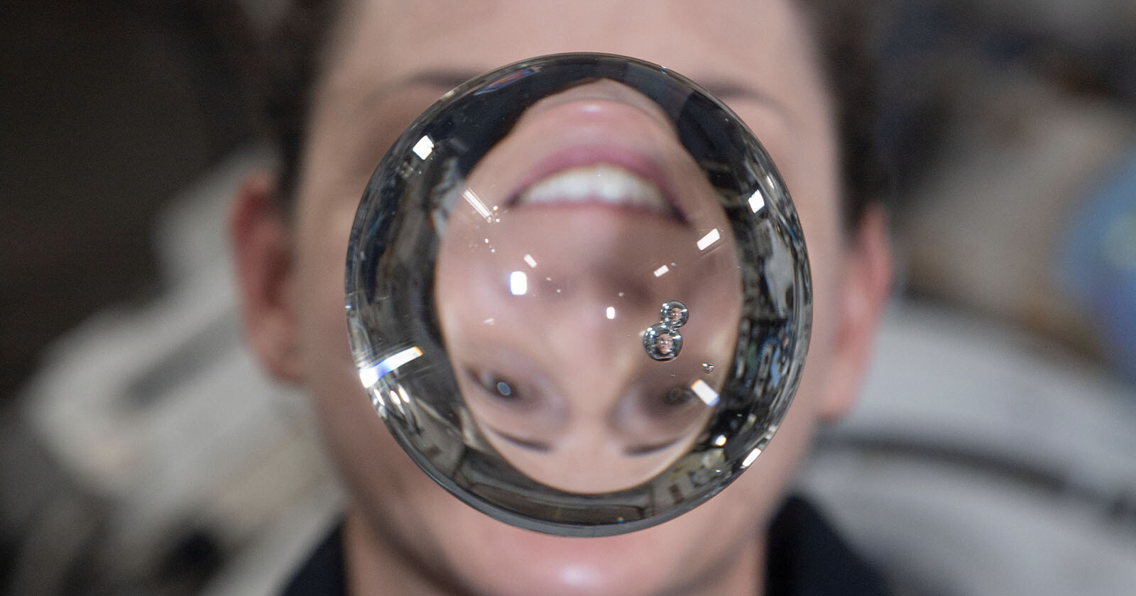 Astronaut Nicole Mann's image refracted through water