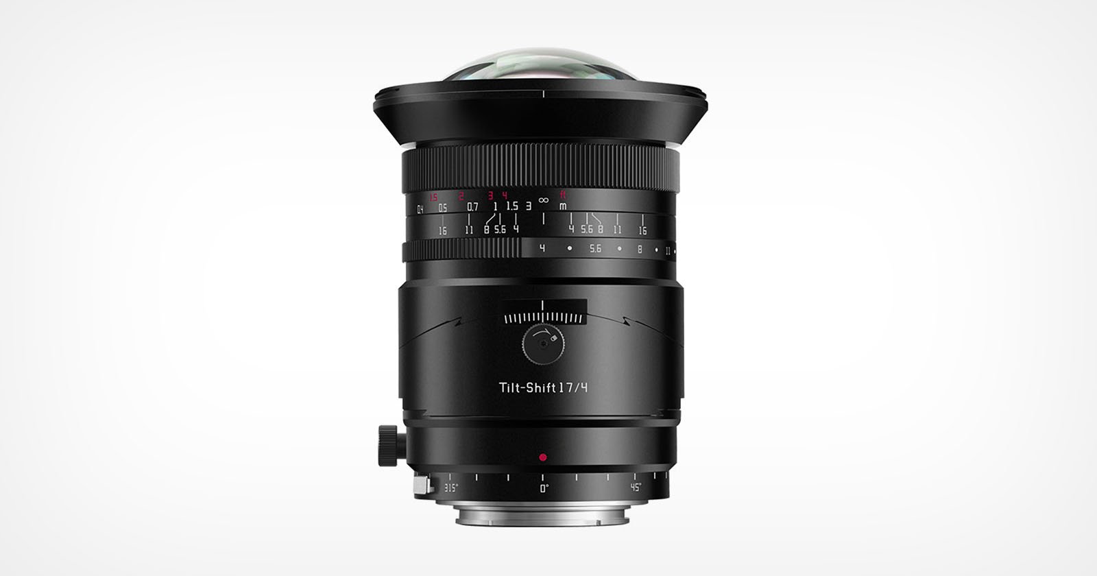 A black tilt-shift camera lens is displayed upright against a plain white background, showing focus and aperture markings, adjustment knobs, and a wide, domed front glass element.