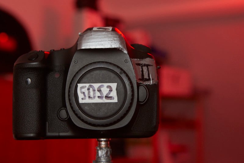 A DSLR camera on a tripod