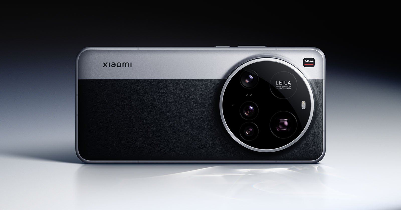 A sleek smartphone with a prominent circular camera module labeled Leica on the back. The design features a dual-tone finish with metallic and textured surfaces. The brand name Xiaomi is visible on the upper left.