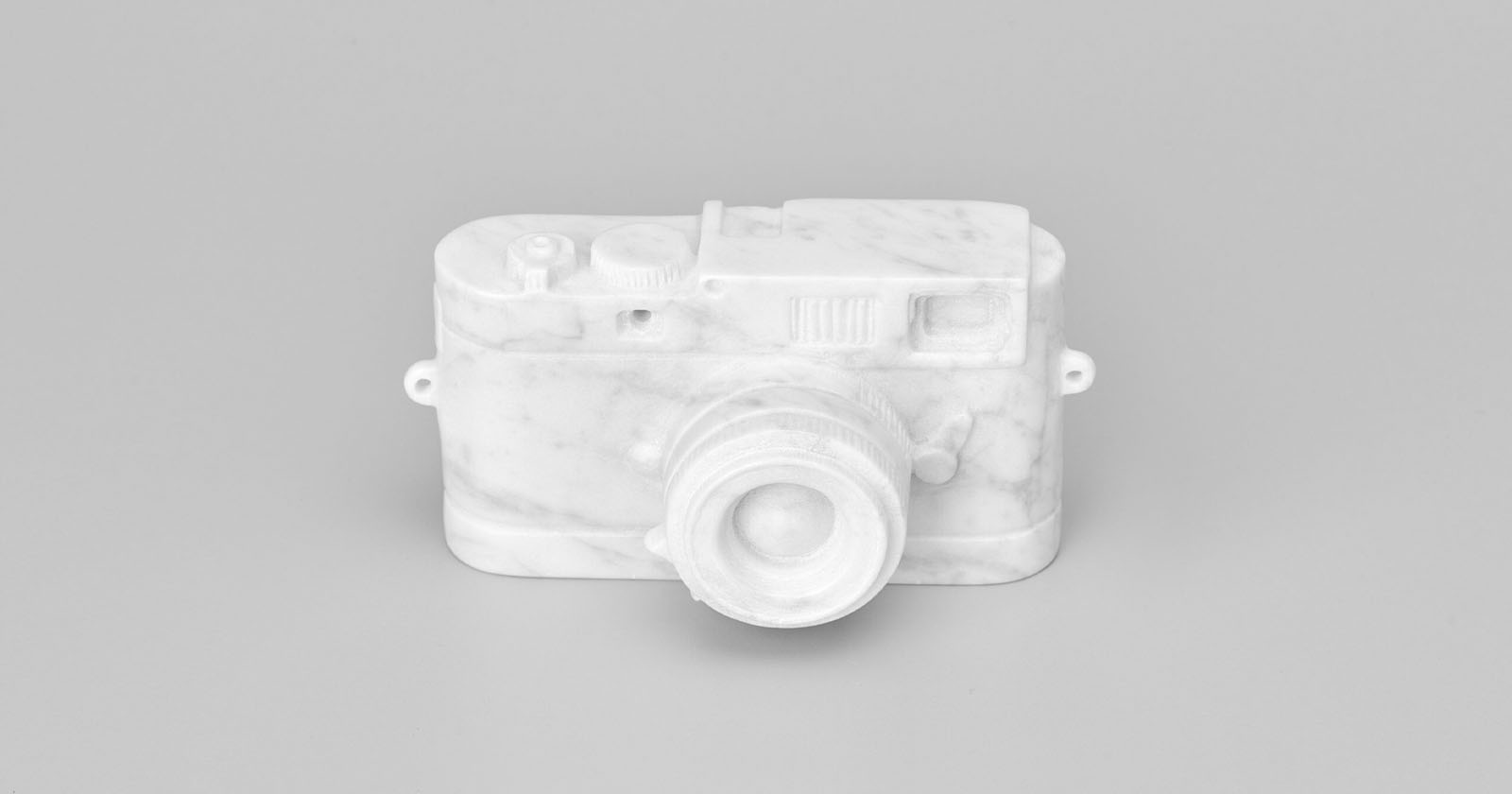 marble sculpture of a leica camera
