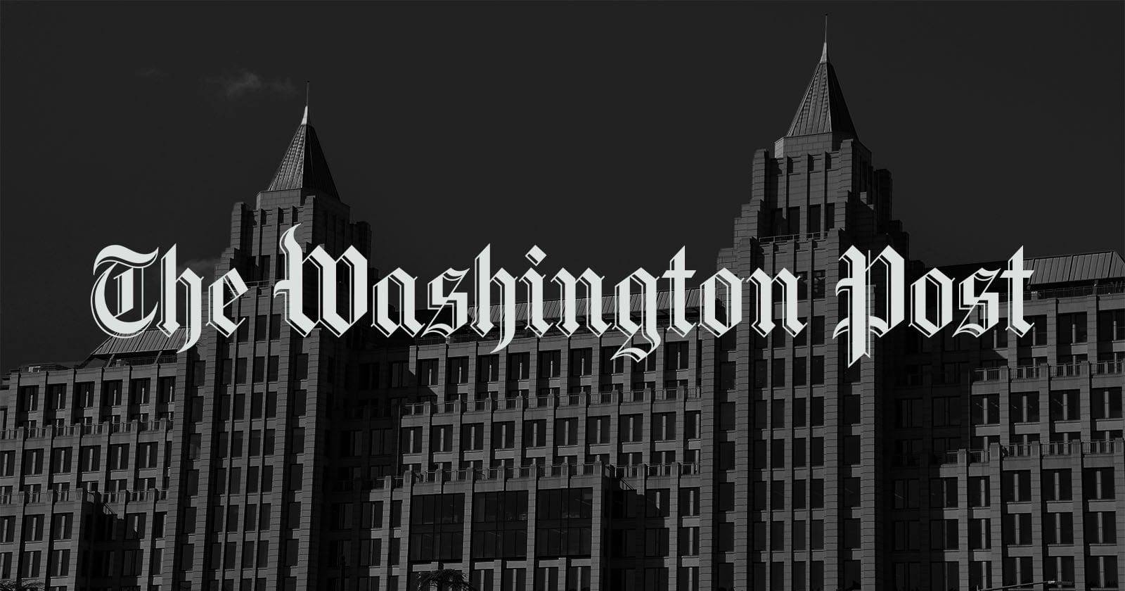 The Washington Post logo in bold, gothic-style white text is overlaid on a grayscale image of a large, multi-story building with pointed towers.