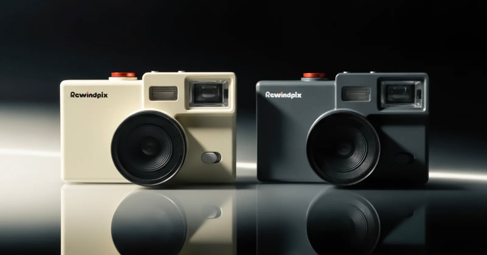 Two retro-style cameras, one beige and one black, labeled Rewindpix, are side by side on a glossy surface with a dark background. Both cameras feature large lenses and prominent viewfinders.