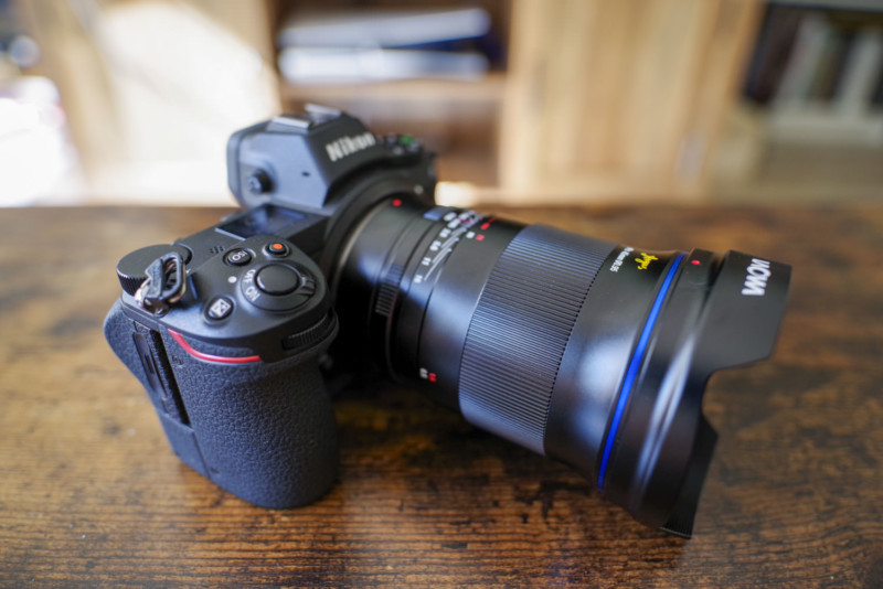 The Laowa Argus 45mm f/0.95 FF camera lens sitting on a table