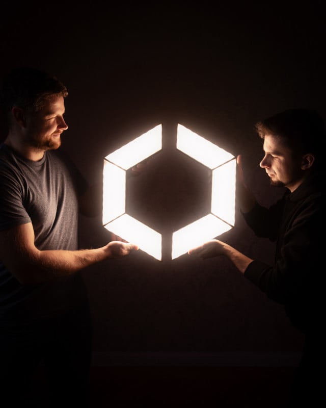 Aptolux_team_holding_lights_3-640x800.jpeg