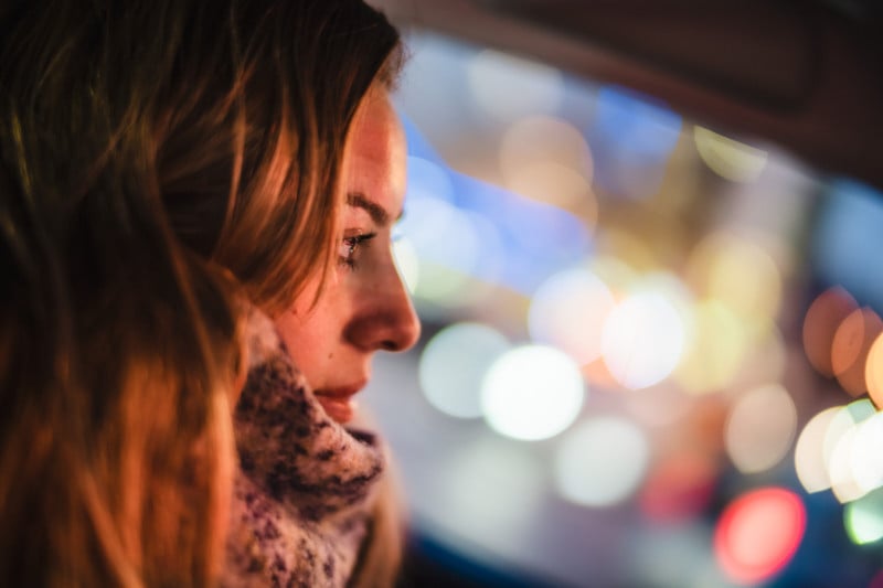 A portrait of a woman in a car