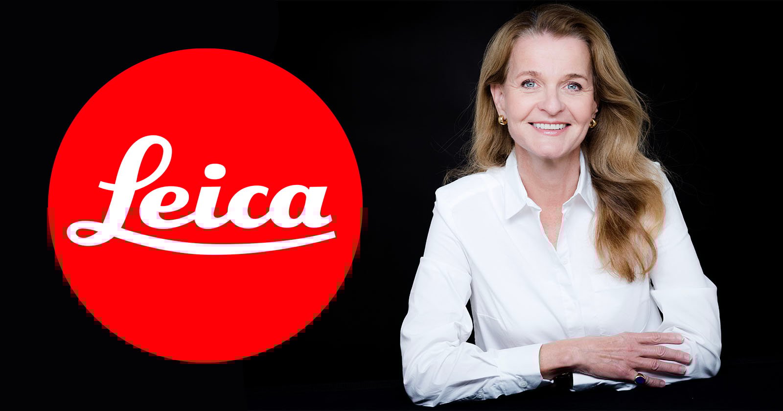 A woman with long brown hair, wearing a white blouse, smiles while sitting with her hands folded. She is positioned next to a large red circular Leica logo on a black background.