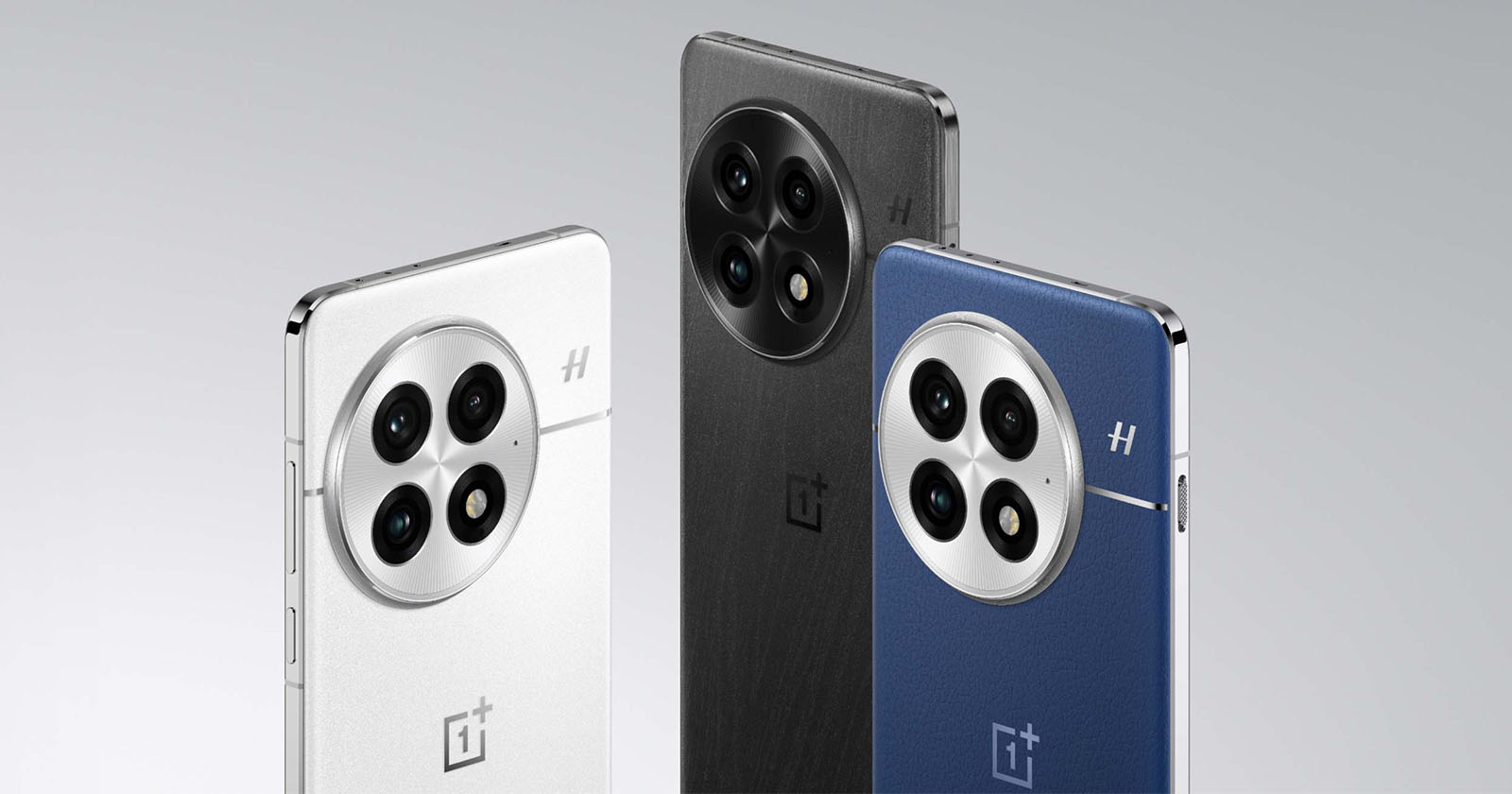 Three smartphones are displayed, showcasing their backs. The phones feature a circular triple-camera module with a textured finish. The colors from left to right are white, black, and blue. Each phone has a shiny metallic edge and a logo below the cameras.