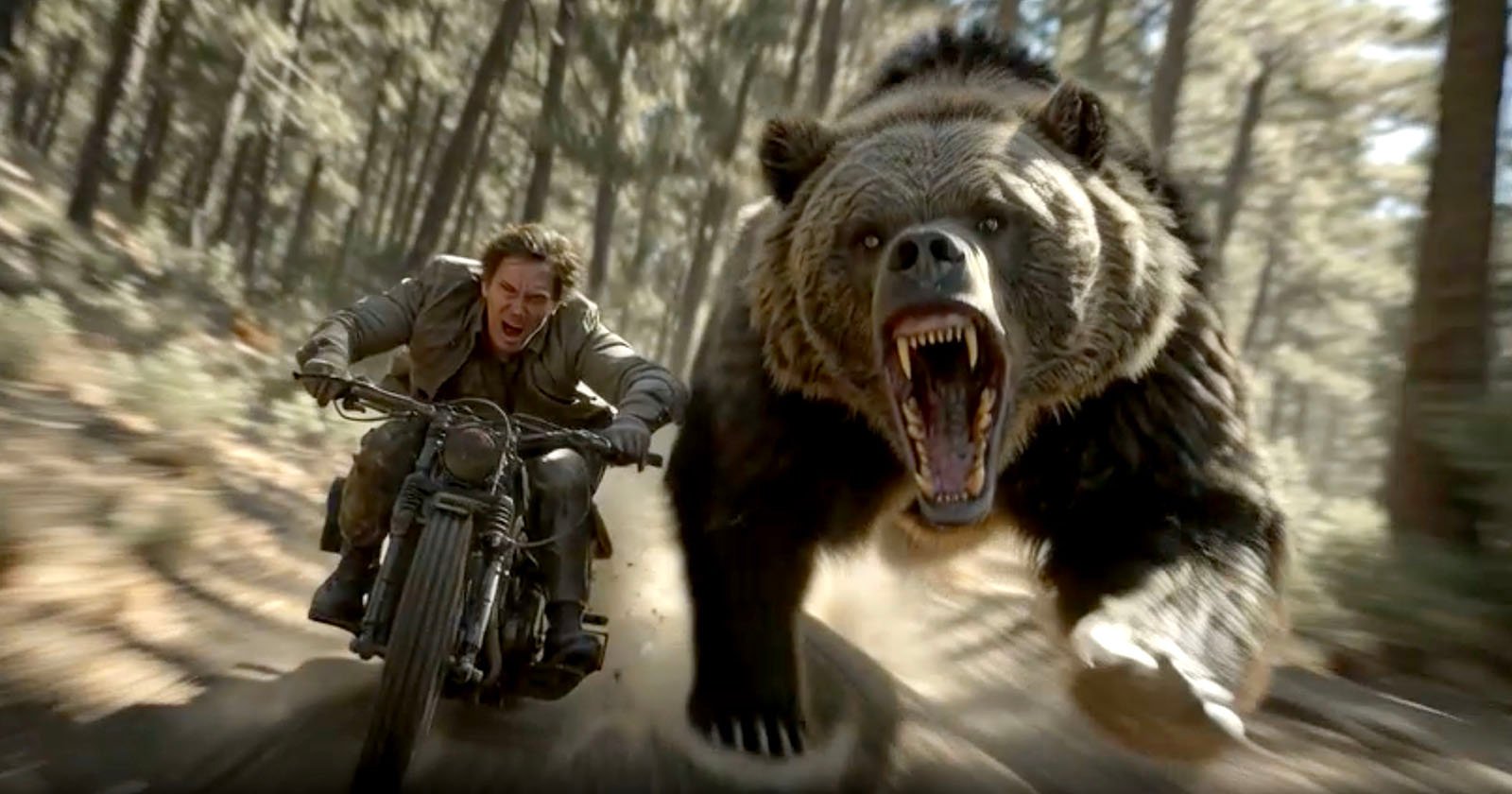 A man on a motorcycle speeds through a forest, looking back in fear as a large, roaring bear chases closely behind him, both kicking up dirt from the forest floor.