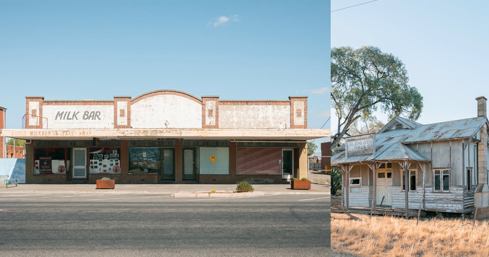 Two old, weathered buildings: on the left, a closed Milk Bar with faded signage and boarded windows; on the right, a dilapidated wooden house with peeling paint and broken windows, set among dry grass.