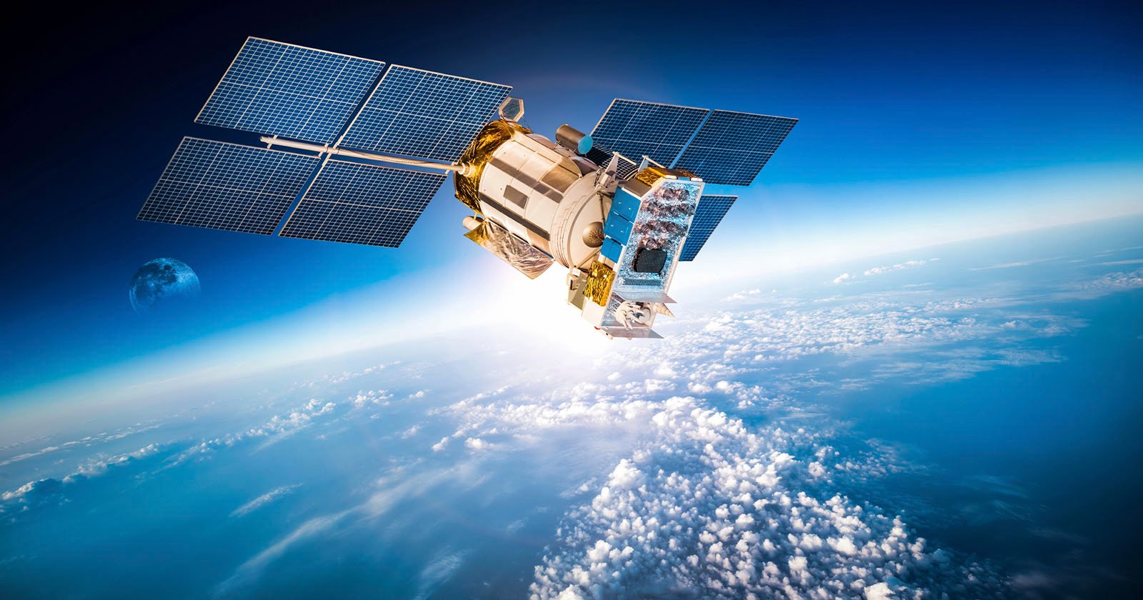 A satellite orbits above Earth’s atmosphere, with solar panels extended and clouds, the planet’s surface, and the Moon visible in the background.