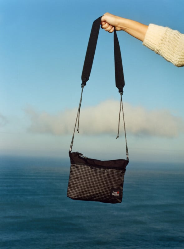 Long Weekend crossbody with ocean background