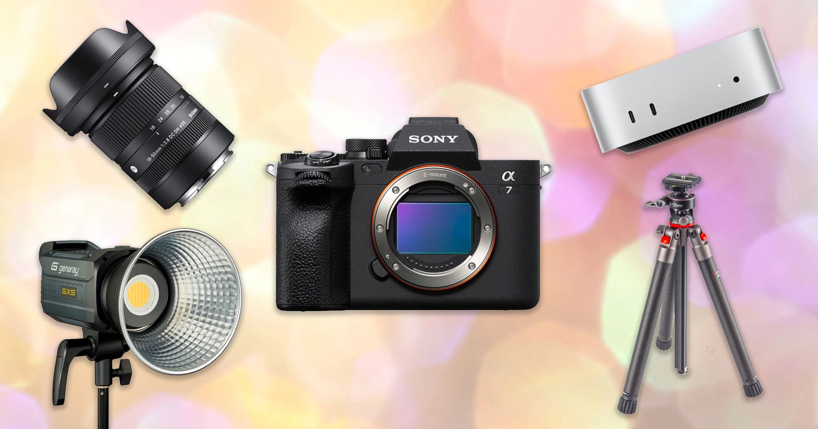 A camera, lens, studio light, tripod, and small desktop computer are displayed on a colorful, blurred background.