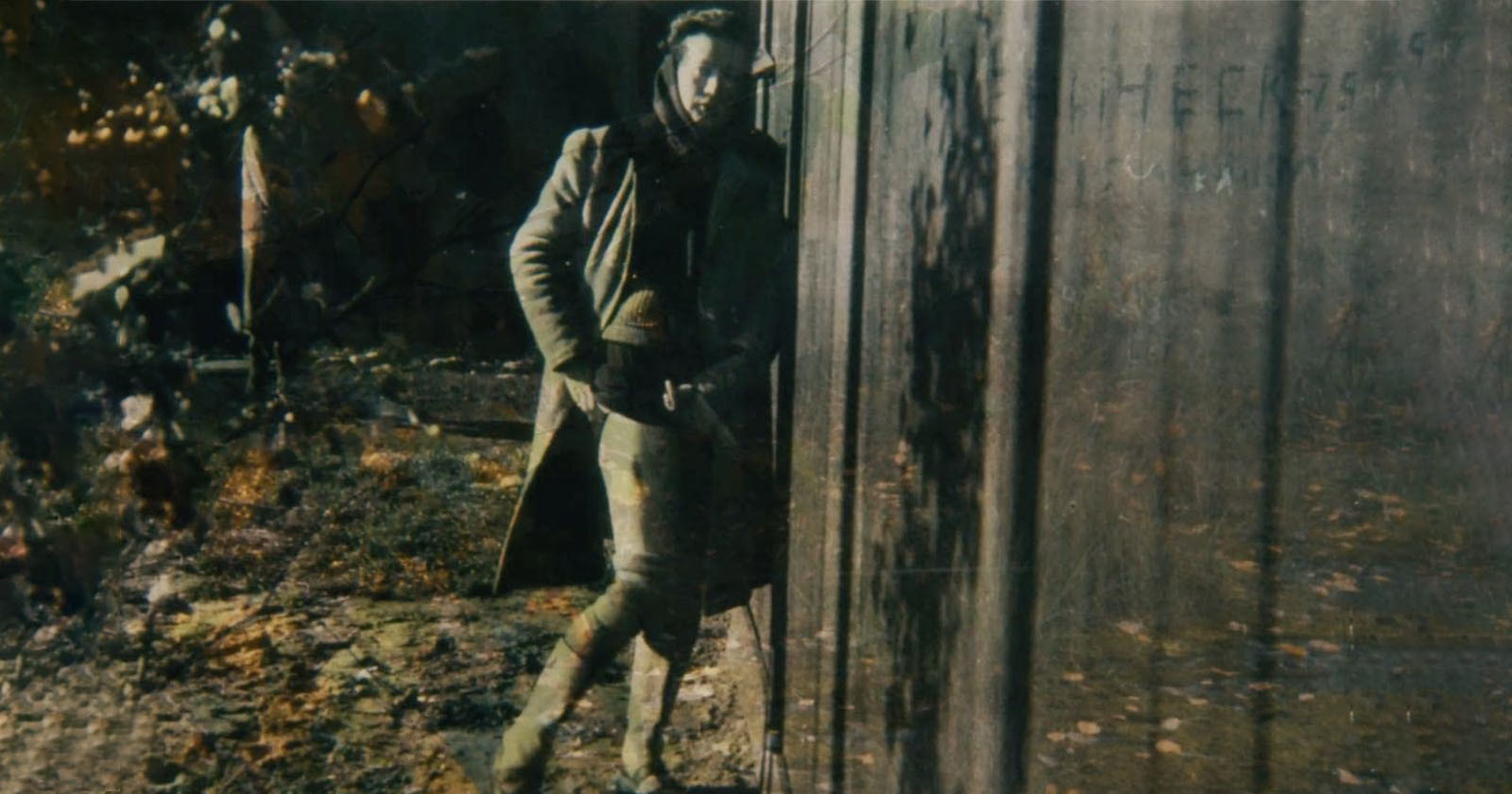 woman posing in concentration camp