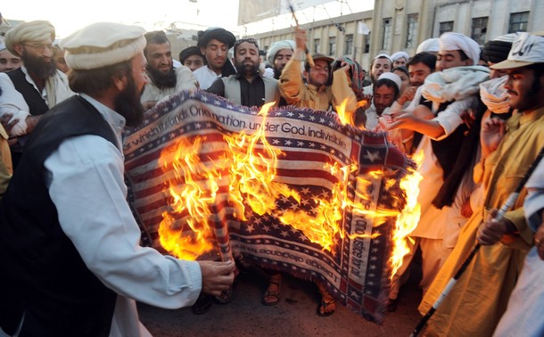 Supporters+of+hardline+pro-Taliban+party+Jamiat+Ulema-i-Islam-Nazaryati+(JUI-N)+burn+a+US+flag+during+a+protest+in+Quetta+on+June+18,+2009+against+the+military+operation+against+Taliban+militants+in+Swat+and+Buner+Valleys.jpg