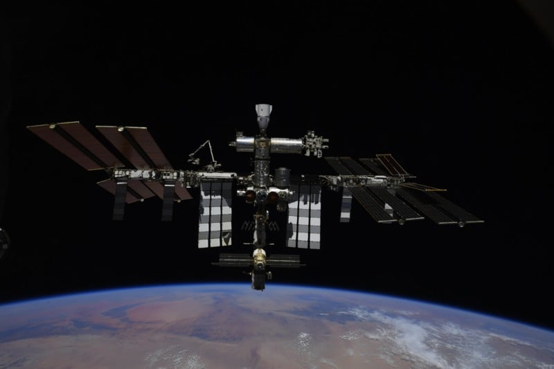 the international space station as it orbits over Earth