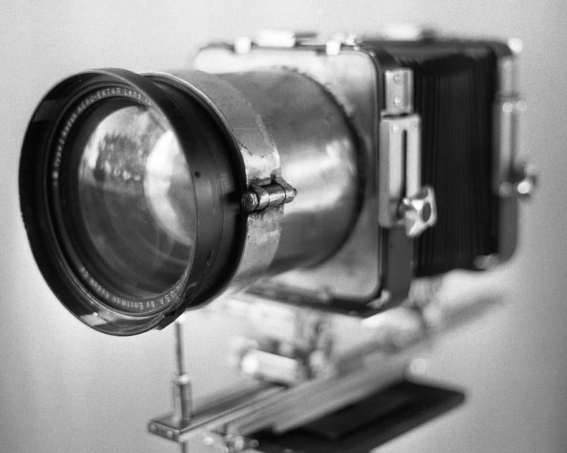 A large Aero Ektar lens mounted to a large format camera