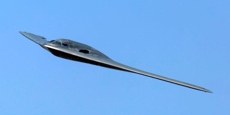 A photo of a B-2 stealth bomber in mid-flight A photo of a B-2 stealth bomber in mid-flight