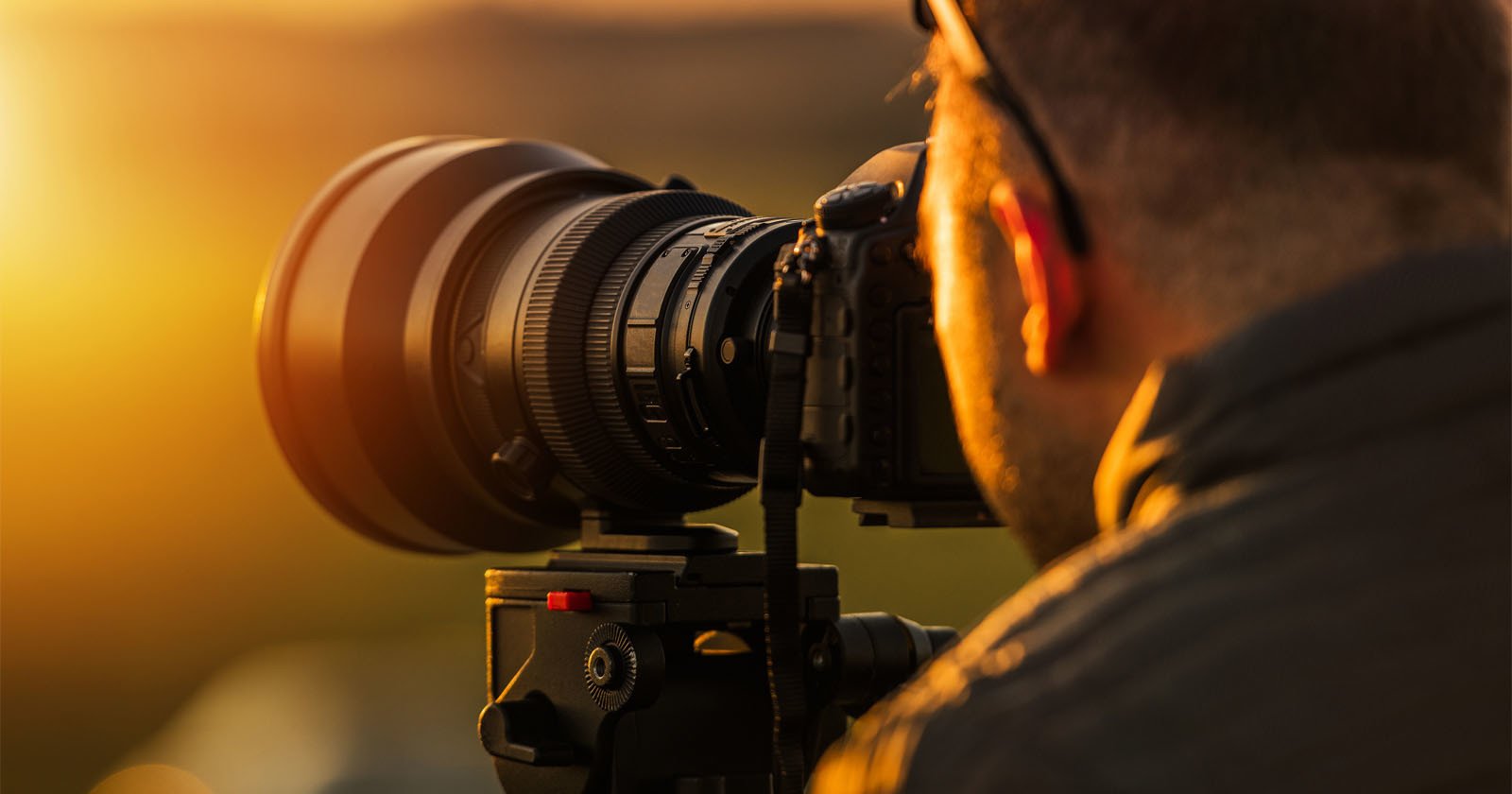 photographer with camera and lens photographer with camera and lens